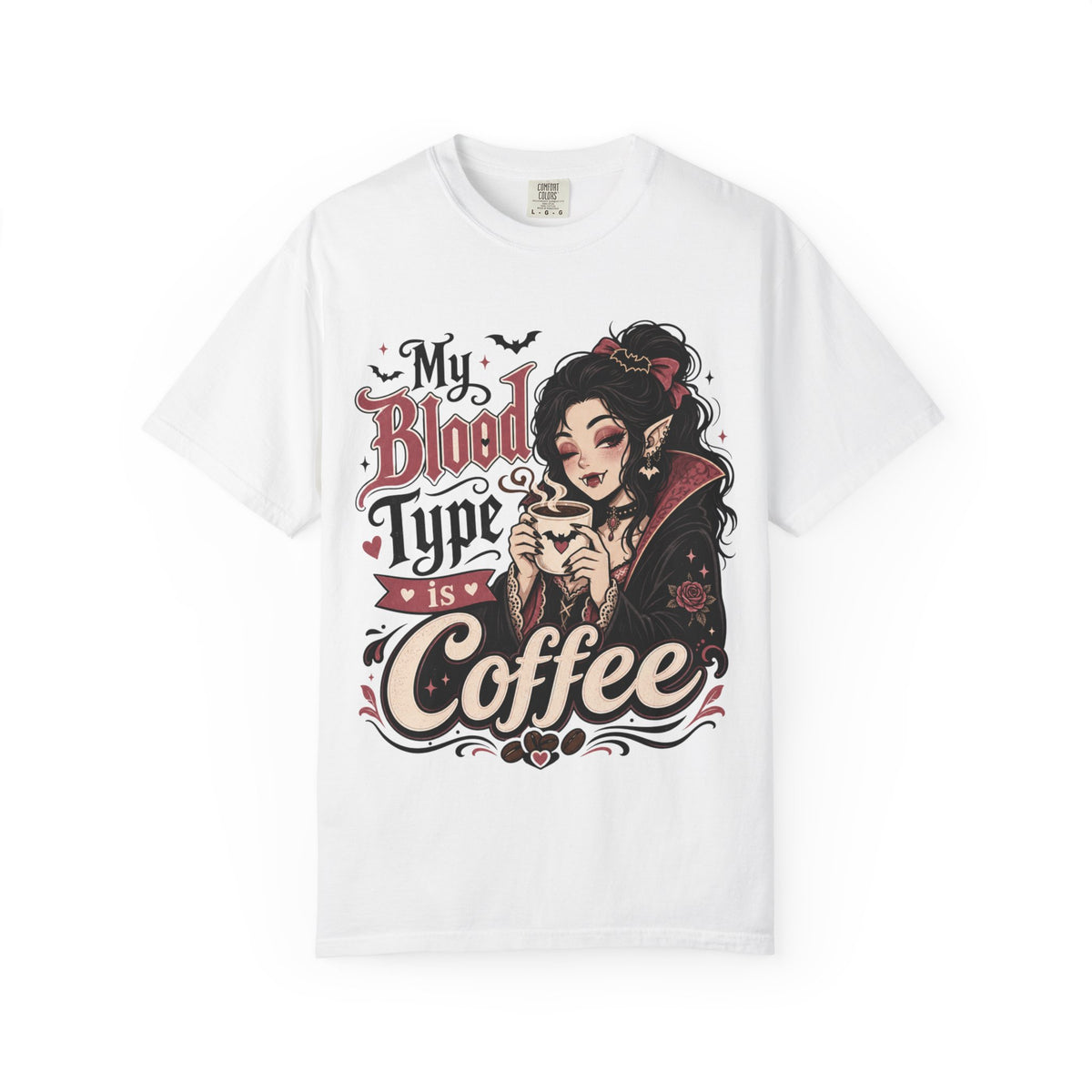 A white short-sleeve crewneck t-shirt featuring a gothic-style graphic print of a vampire woman and the text 'My Blood Type is Coffee' in stylized red and beige lettering.