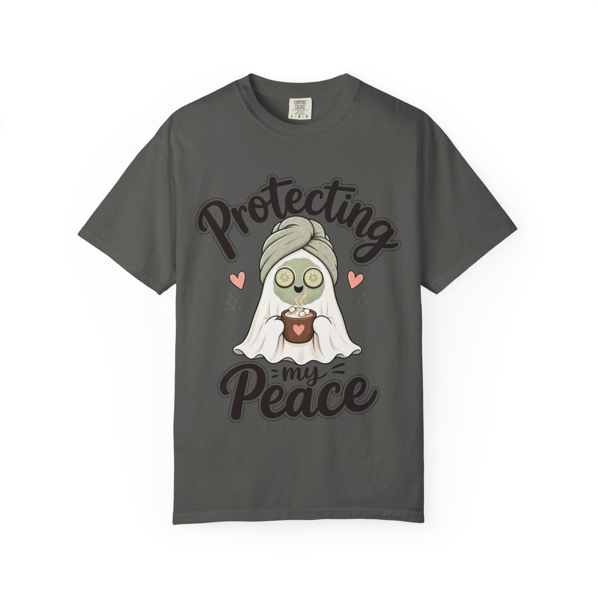 A dark gray short-sleeve crewneck t-shirt featuring a graphic of a cartoon ghost wearing a green head wrap, spa mask and holding a cup, with the text 'Protecting my Peace' written in black script.
