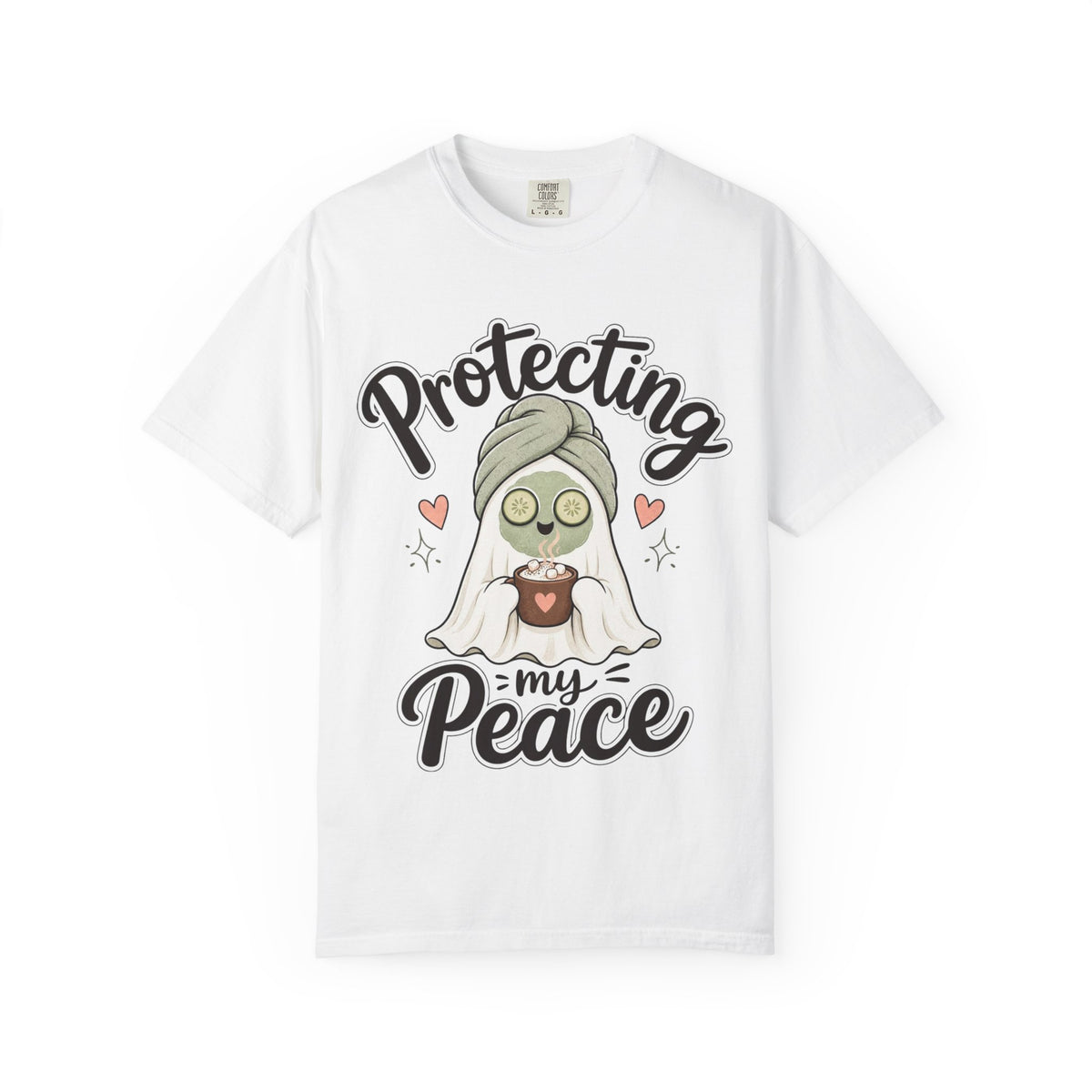 A white short-sleeve crewneck t-shirt featuring a graphic of a cartoon ghost wearing a green head wrap, spa mask and holding a cup, with the text 'Protecting my Peace' written in black script.