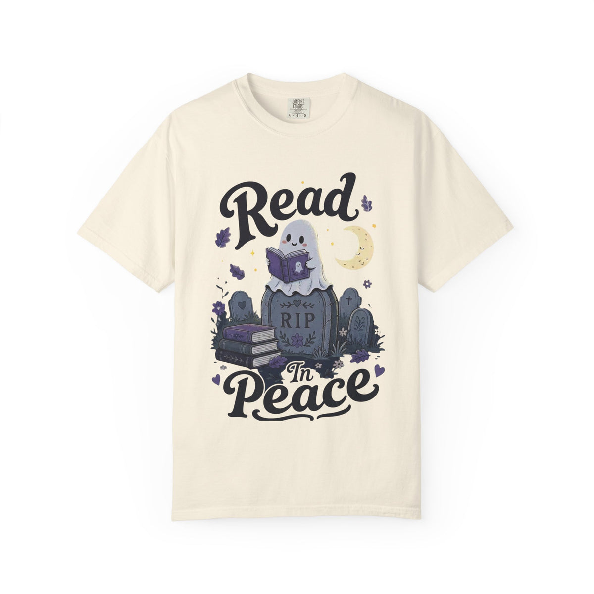 A off-white short-sleeve crewneck t-shirt featuring a cute Halloween graphic of a ghost reading a book on top of a tombstone that says 'RIP', with the words 'Read In Peace' written in stylized lettering.
