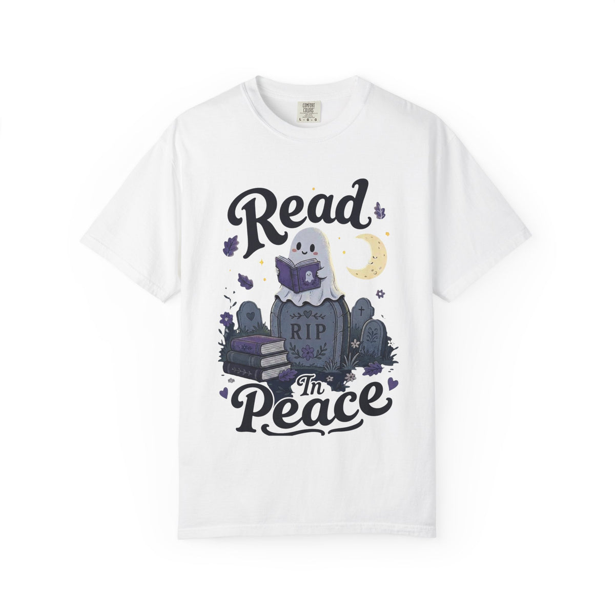 A white short-sleeve crewneck t-shirt featuring a cute Halloween graphic of a ghost reading a book on top of a tombstone that says 'RIP', with the words 'Read In Peace' written in stylized lettering.