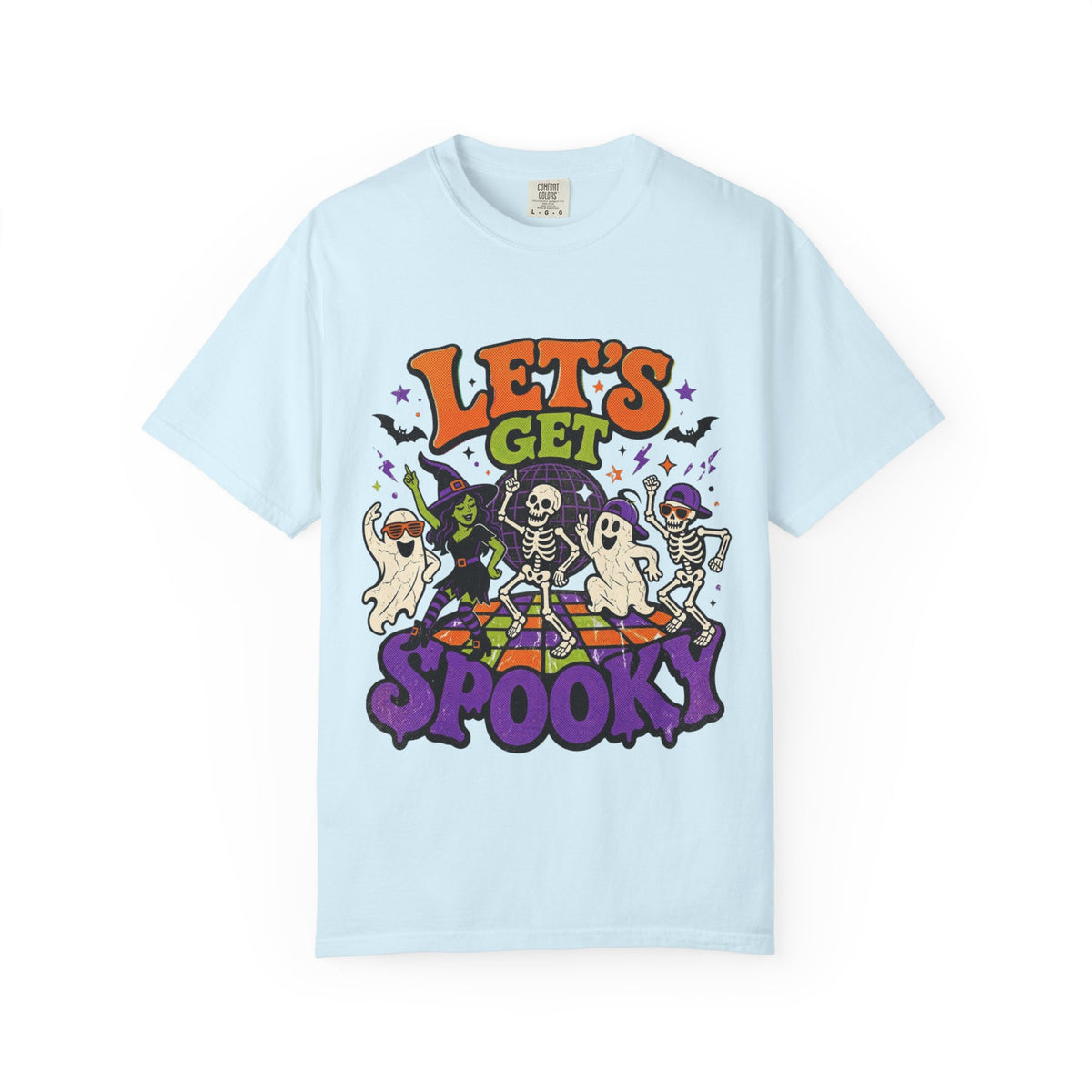 A light blue short-sleeve crewneck t-shirt featuring a colorful Halloween graphic on the front with the text 'LET'S GET SPOOKY' and cartoon ghosts, skeletons, a witch, and bats.