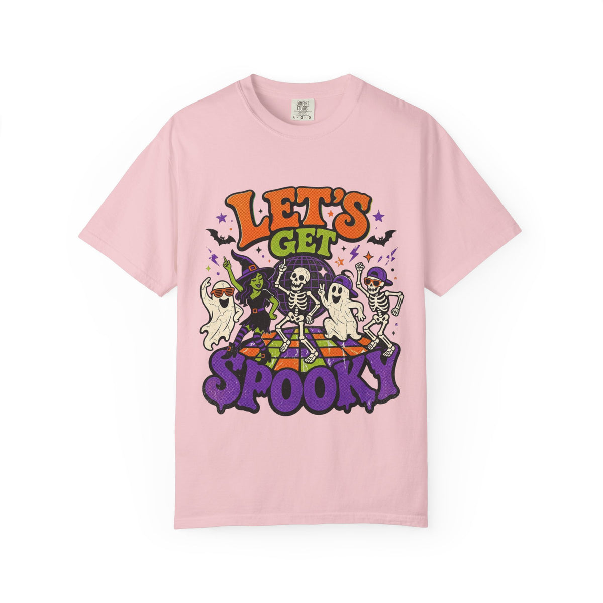 A pink short-sleeve crewneck t-shirt featuring a colorful Halloween graphic on the front with the text 'LET'S GET SPOOKY' and cartoon ghosts, skeletons, a witch, and bats.