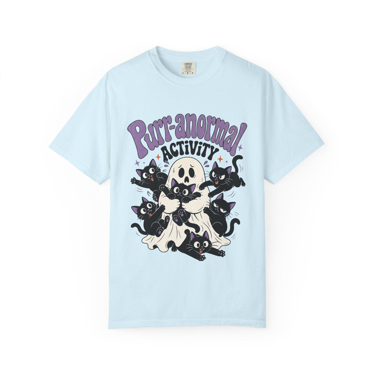 A light blue short-sleeve crewneck t-shirt featuring a cartoon graphic of black cats, a skull, and a ghost with the text 'Purr-anormal! ACTIVITY' in purple and black.