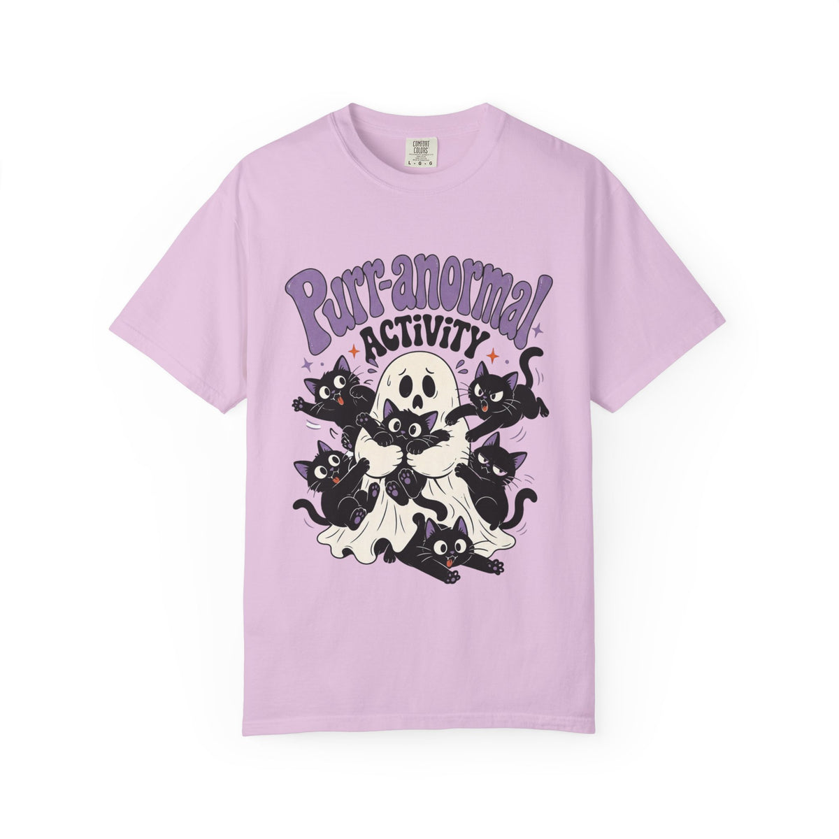 A light purple short-sleeve crewneck t-shirt featuring a cartoon graphic of black cats, a skull, and a ghost with the text 'Purr-anormal! ACTIVITY' in purple and black.