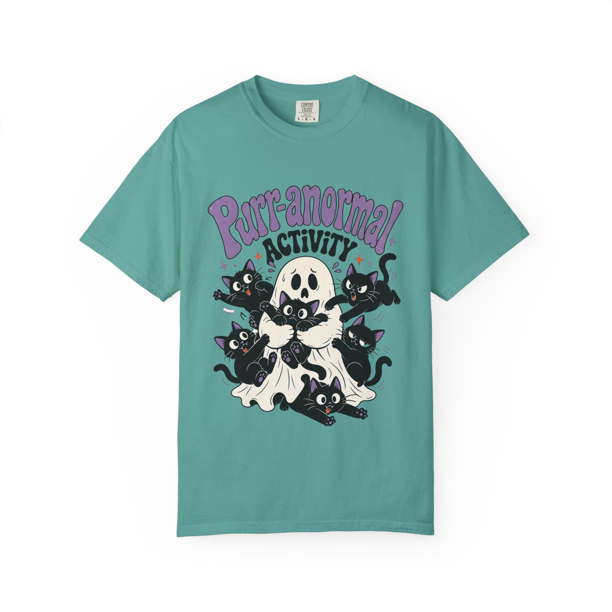 A teal short-sleeve crewneck t-shirt featuring a cartoon graphic of black cats, a skull, and a ghost with the text 'Purr-anormal! ACTIVITY' in purple and black.