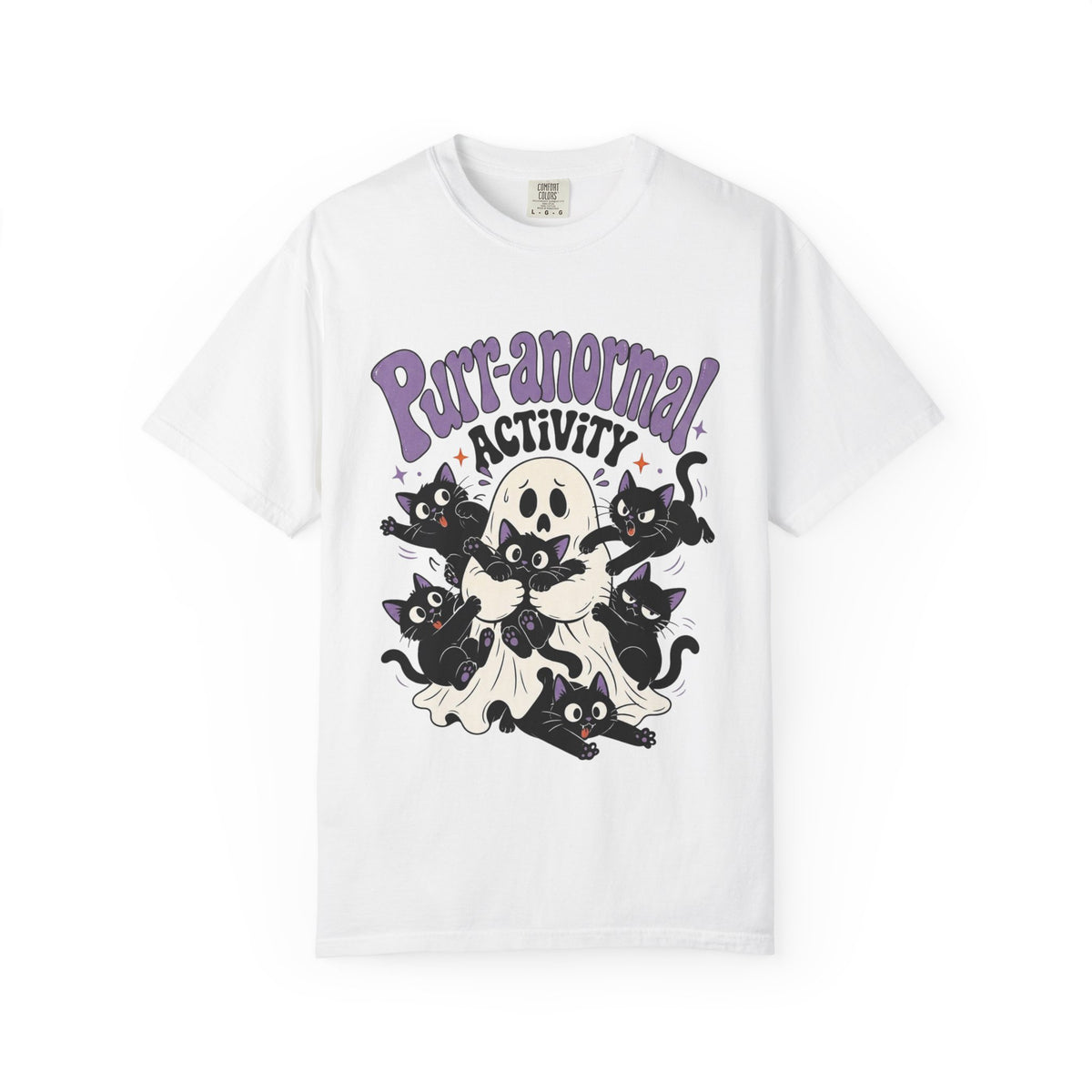 A white short-sleeve crewneck t-shirt featuring a cartoon graphic of black cats, a skull, and a ghost with the text 'Purr-anormal! ACTIVITY' in purple and black.