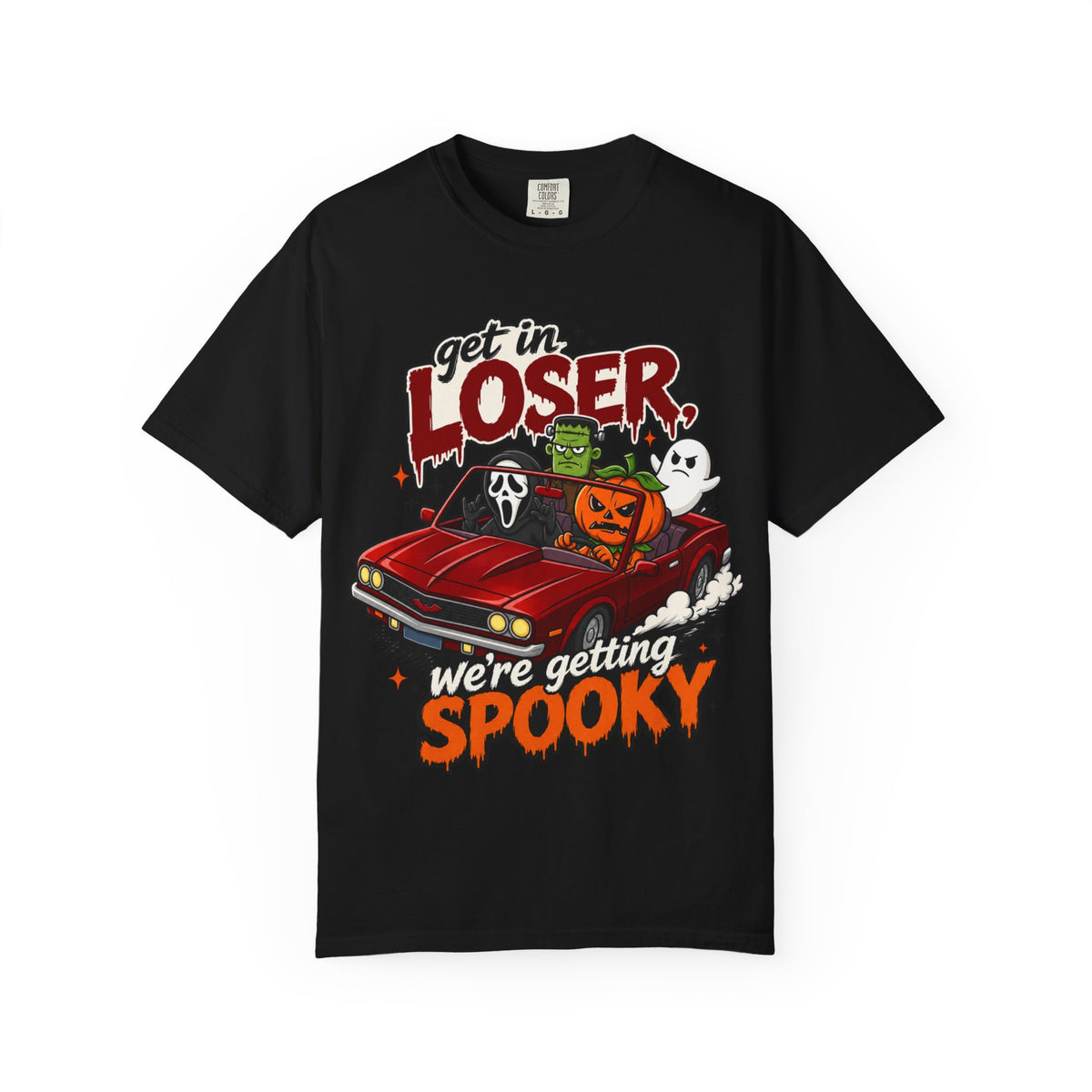 A black short-sleeve crewneck t-shirt featuring a colorful Halloween graphic on the front showing a red convertible car with ghosts, a pumpkin, and Frankenstein, with the text 'Get in LOSER, we're getting SPOOKY'.