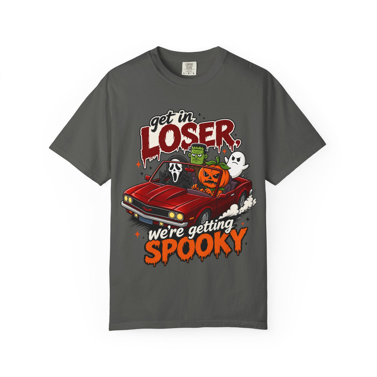 A dark gray short-sleeve crewneck t-shirt featuring a colorful Halloween graphic on the front showing a red convertible car with ghosts, a pumpkin, and Frankenstein, with the text 'Get in LOSER, we're getting SPOOKY'.
