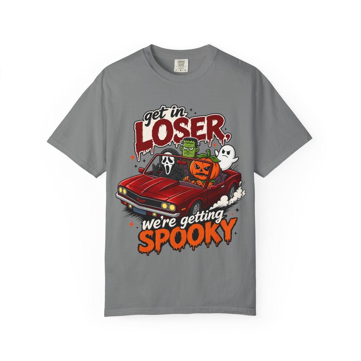 A gray short-sleeve crewneck t-shirt featuring a colorful Halloween graphic on the front showing a red convertible car with ghosts, a pumpkin, and Frankenstein, with the text 'Get in LOSER, we're getting SPOOKY'.