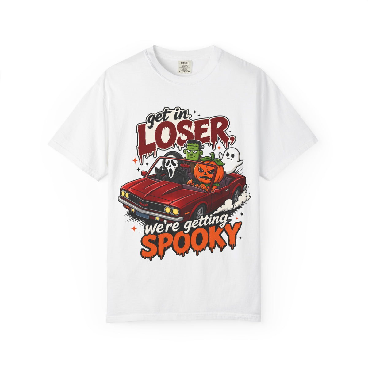 A white short-sleeve crewneck t-shirt featuring a colorful Halloween graphic on the front showing a red convertible car with ghosts, a pumpkin, and Frankenstein, with the text 'Get in LOSER, we're getting SPOOKY'.