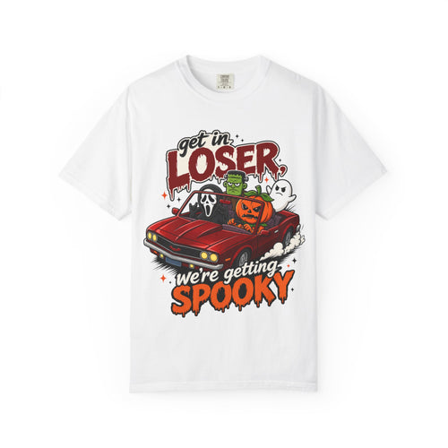 A white short-sleeve crewneck t-shirt featuring a colorful Halloween graphic on the front showing a red convertible car with ghosts, a pumpkin, and Frankenstein, with the text 'Get in LOSER, we're getting SPOOKY'.