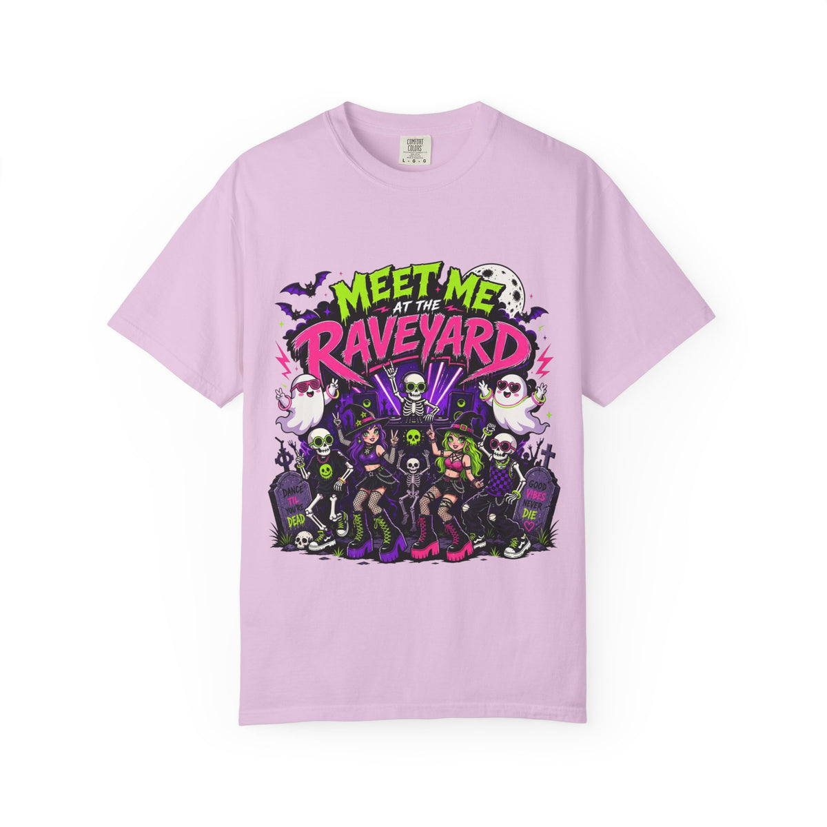 A light pink short-sleeve crewneck t-shirt featuring a colorful graphic print on the front with the text 'MEET ME AT THE RAVEYARD' and a group of cartoon-style gothic characters.