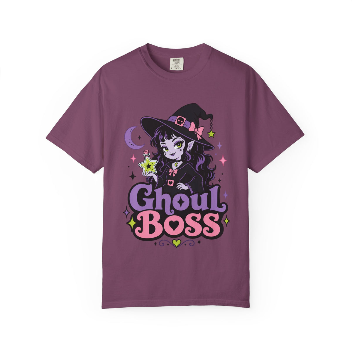 A dark purple short-sleeve crewneck t-shirt featuring a colorful graphic of a cute anime-style witch girl with the text 'Ghoul BOSS' in purple and pink.