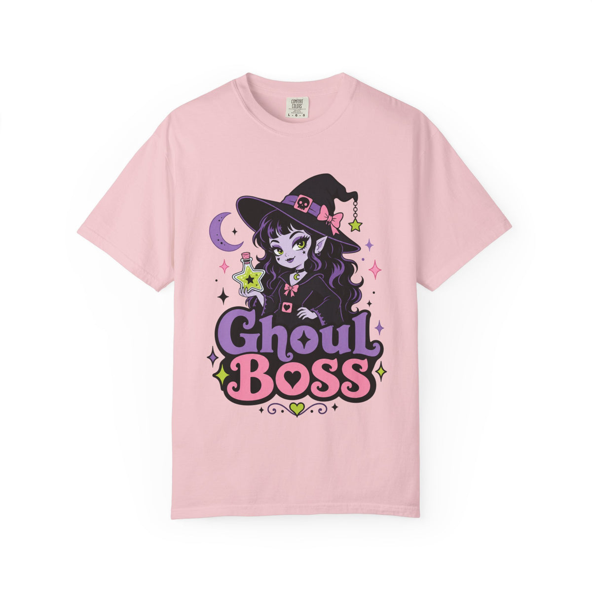 A light pink short-sleeve crewneck t-shirt featuring a colorful graphic of a cute anime-style witch girl with the text 'Ghoul BOSS' in purple and pink.
