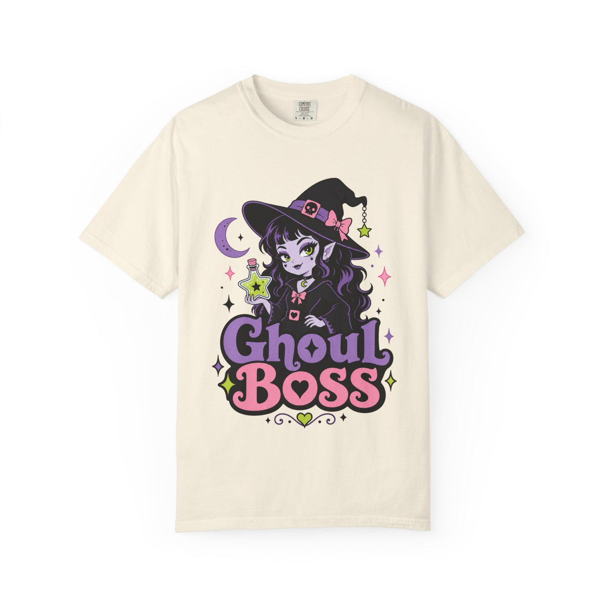 A off-white short-sleeve crewneck t-shirt featuring a colorful graphic of a cute anime-style witch girl with the text 'Ghoul BOSS' in purple and pink.