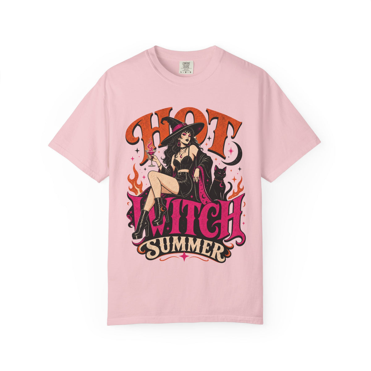 A light pink short-sleeve crewneck t-shirt featuring a colorful graphic print of a witch sitting on a chair with the text 'HOT WITCH SUMMER' in stylized orange and pink lettering.