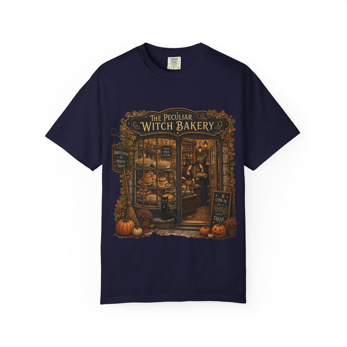A navy blue short-sleeve crewneck t-shirt featuring a detailed graphic print of 'The Peculiar Witch Bakery' on the front, displayed against a clean white background.