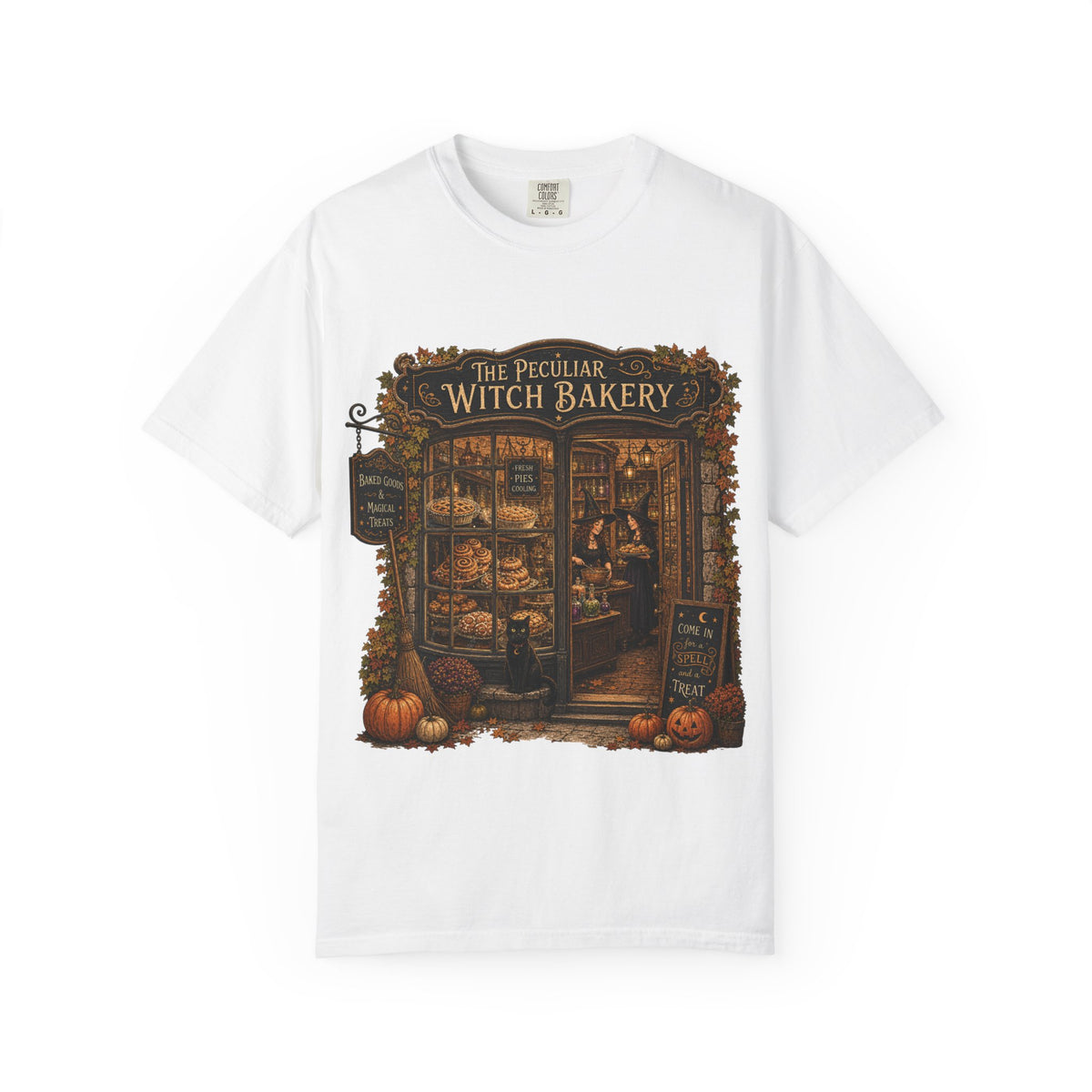 A white short-sleeve crewneck t-shirt featuring a detailed graphic print of 'The Peculiar Witch Bakery' on the front, displayed against a clean white background.