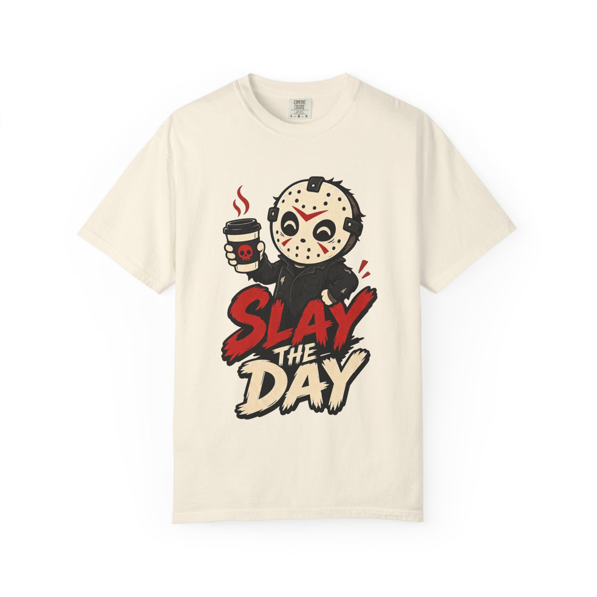 A cream short-sleeve crewneck t-shirt featuring a graphic print of a cute halloween character holding a coffee cup with the text 'SLAY THE DAY' in red and beige lettering.