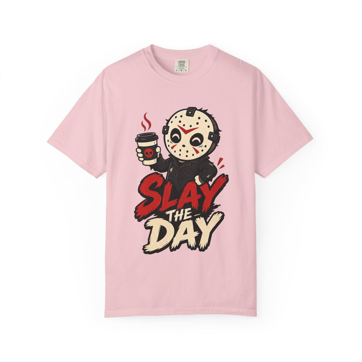 A pink short-sleeve crewneck t-shirt featuring a graphic print of a cute halloween character holding a coffee cup with the text 'SLAY THE DAY' in red and beige lettering.