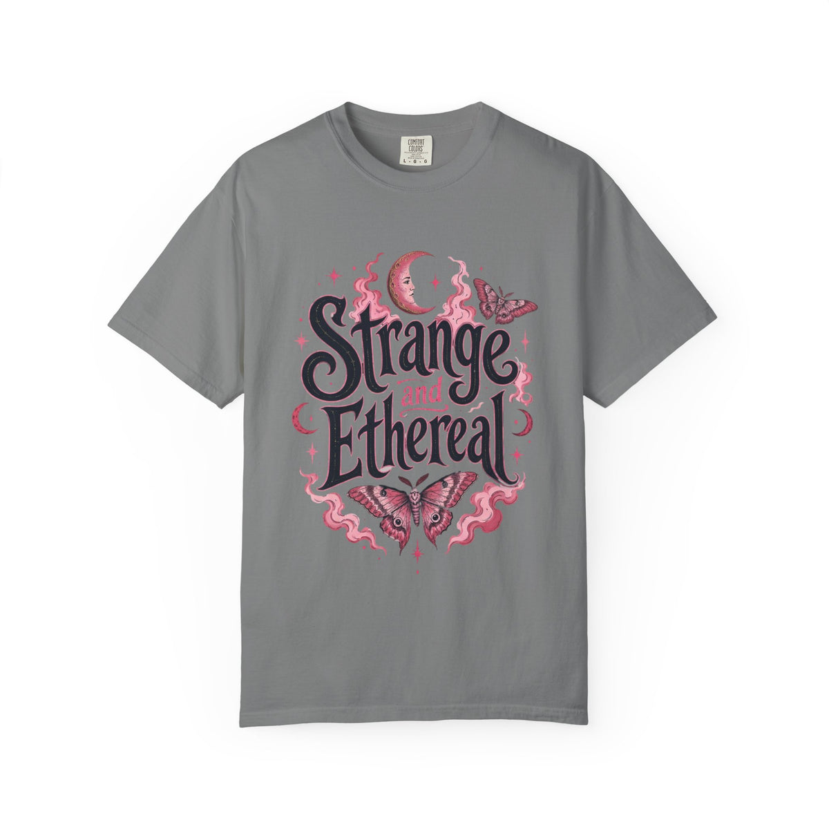 A gray short-sleeve crewneck t-shirt featuring a central graphic with the words 'Strange and Ethereal' in a dark gothic font, surrounded by pink and red butterflies, crescent moons, and sparkles.