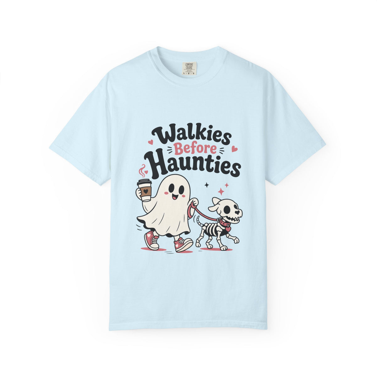 A light blue short-sleeve crewneck t-shirt featuring a cute graphic print of a cartoon ghost and a skeleton dog walking together, with the text 'Walkies Before Haunties' above them.