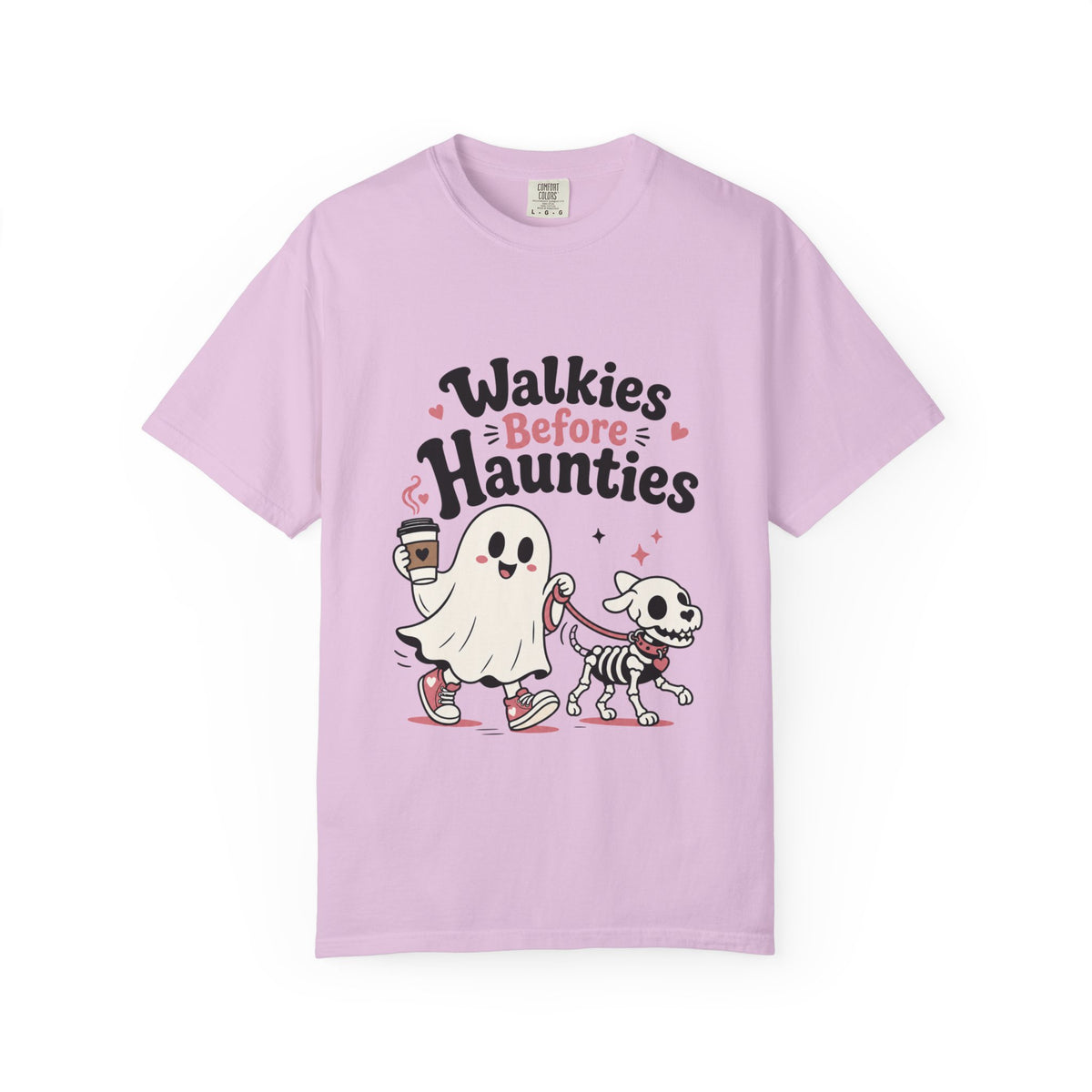 A light purple short-sleeve crewneck t-shirt featuring a cute graphic print of a cartoon ghost and a skeleton dog walking together, with the text 'Walkies Before Haunties' above them.