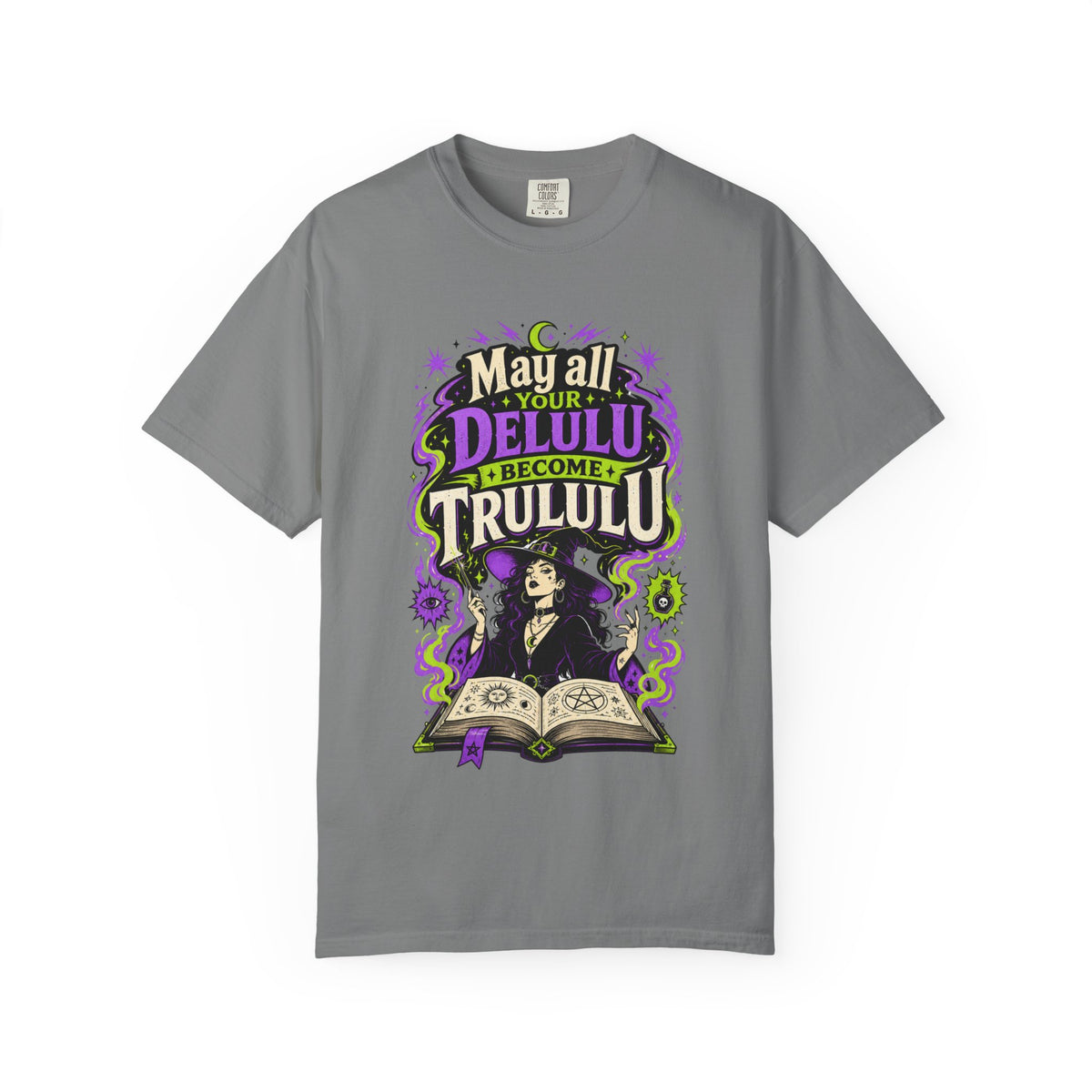 A gray short-sleeve crewneck t-shirt featuring a central graphic with the words 'Strange and Ethereal' in a dark gothic font, surrounded by pink and red butterflies, crescent moons, and sparkles.