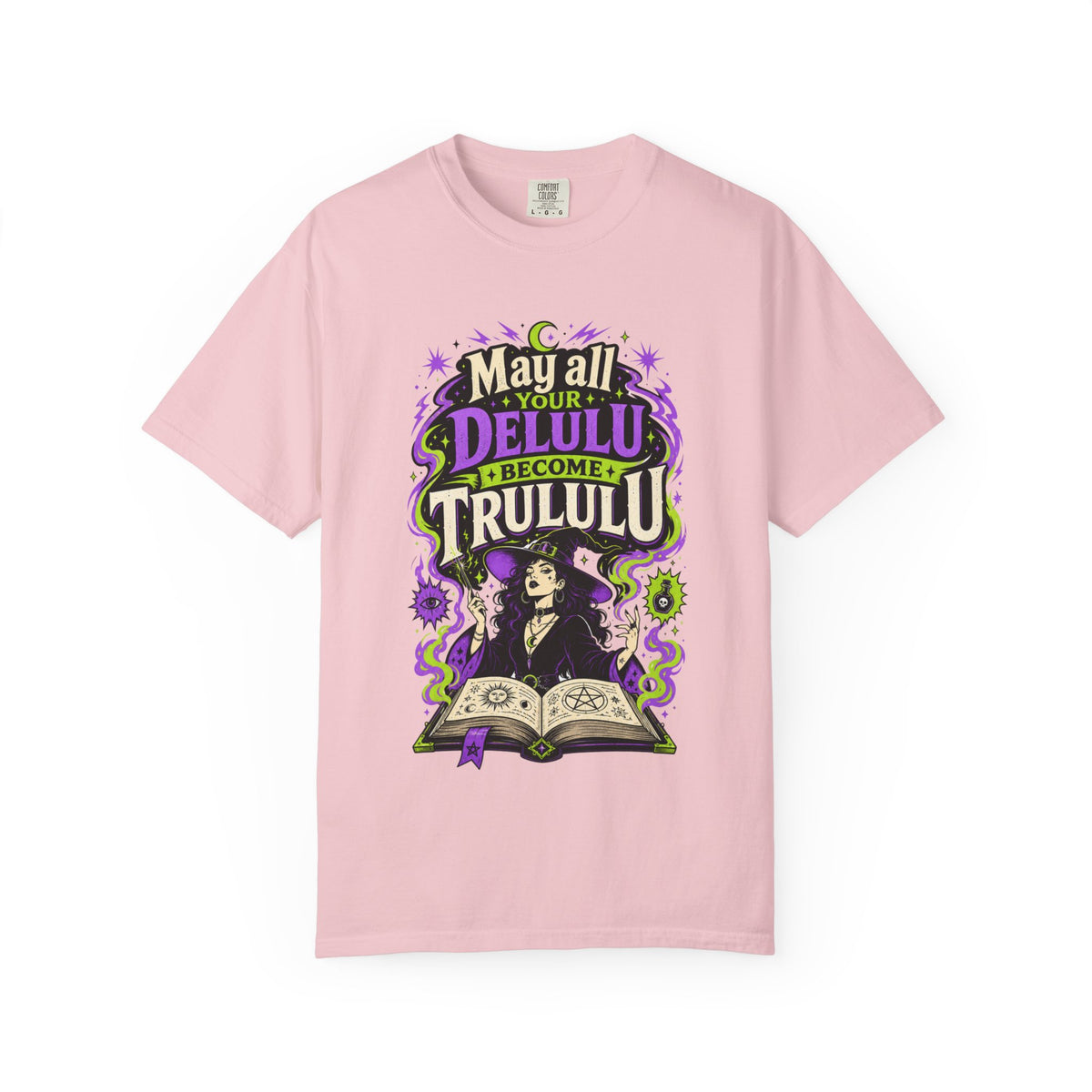 A pink short-sleeve crewneck t-shirt featuring a central graphic with the words 'Strange and Ethereal' in a dark gothic font, surrounded by pink and red butterflies, crescent moons, and sparkles.