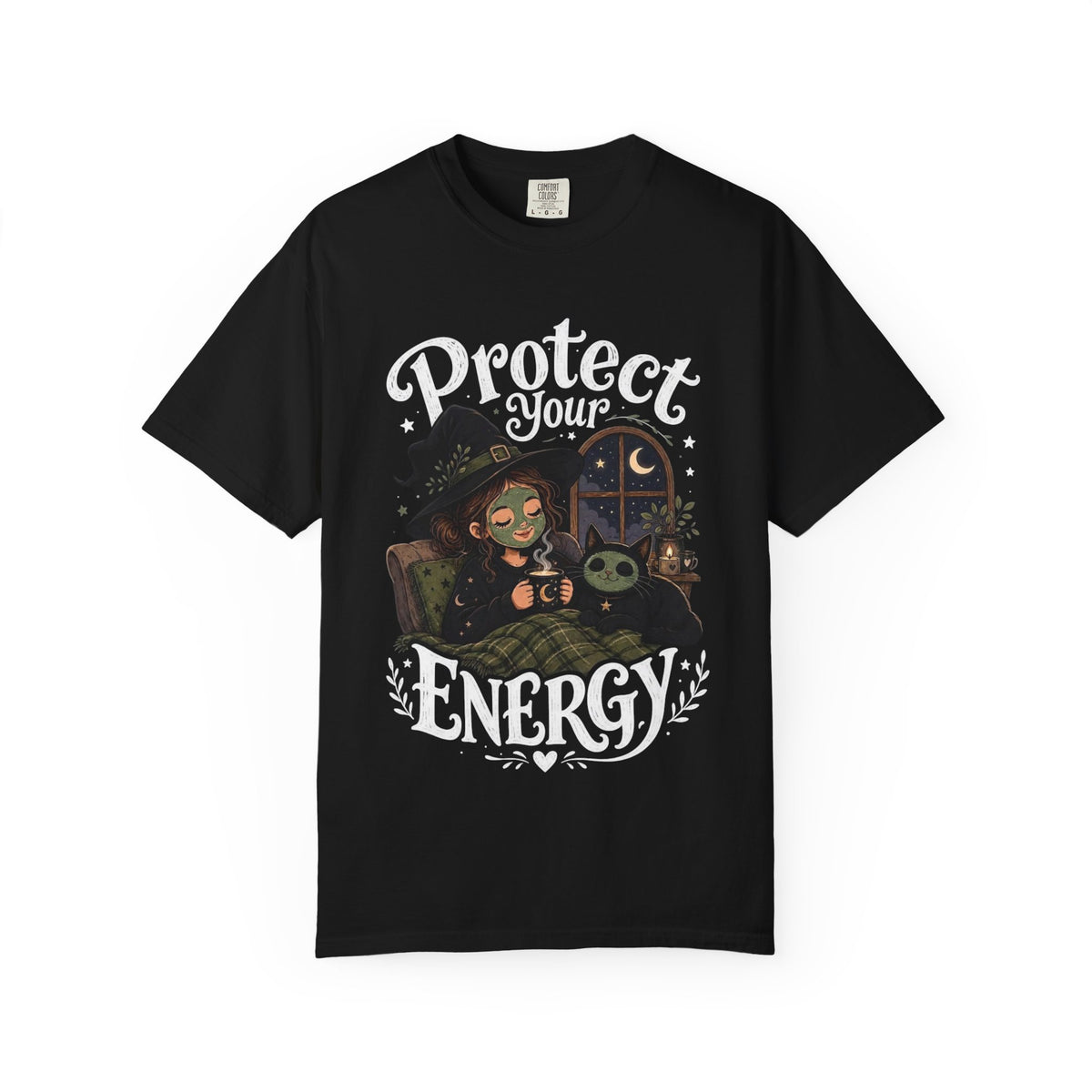 A black short-sleeve crewneck t-shirt featuring a graphic showing a cartoon witch sitting in bed with her cat, both wearing spa face masks, under a window with crescent moon, with the text 'Protect Your Energy' written in a gothic font.